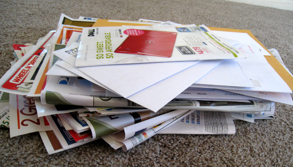 Direct to consumer marketing. A pile of mail wit advertisements